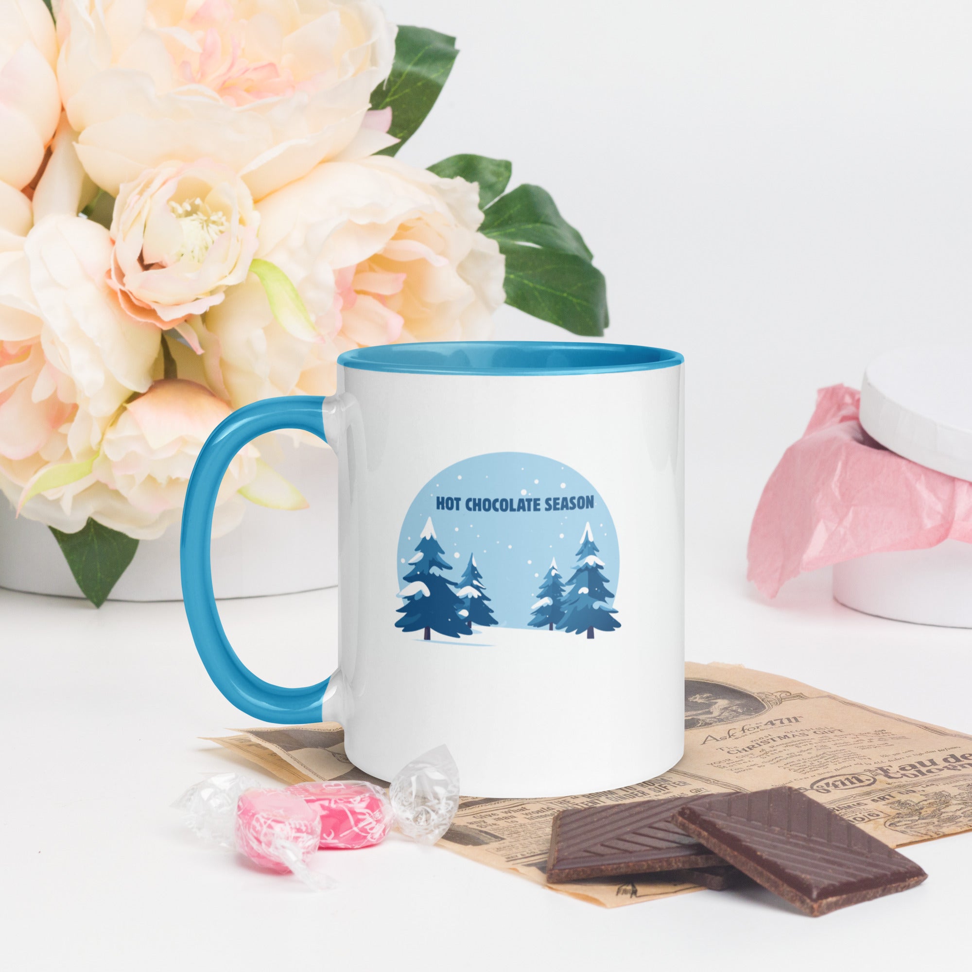 Hot chocolate season white mug with blue interior flowery background 