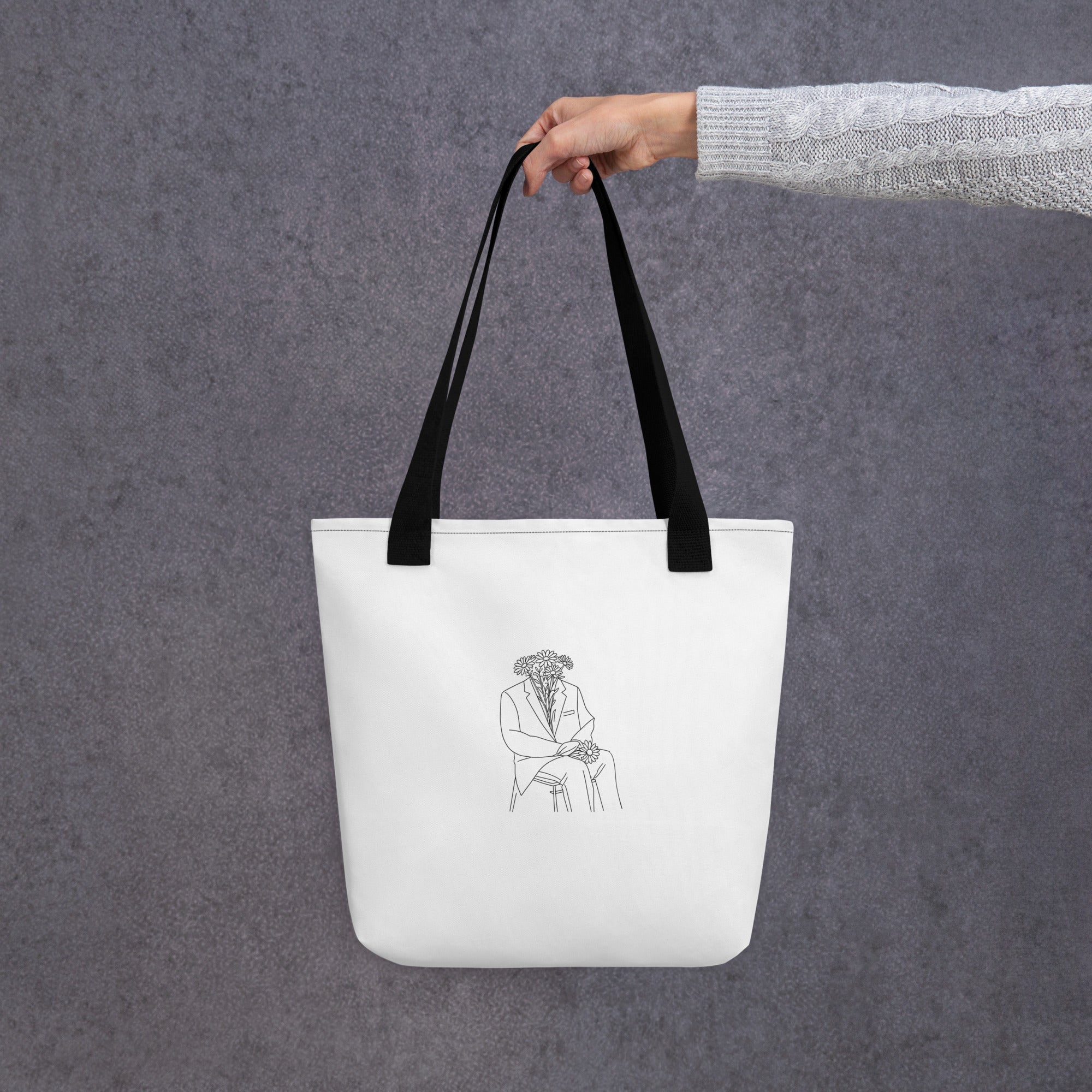 Man in flowers white tote bag with black handle hanged